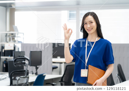 Young female engineer in office casual wear 129118121