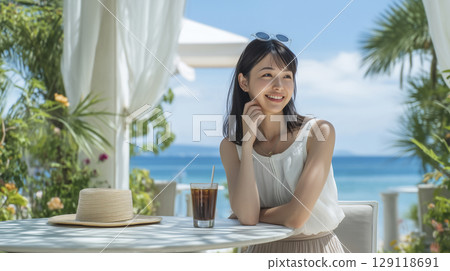 Woman enjoying vacation at summer resort 129118691