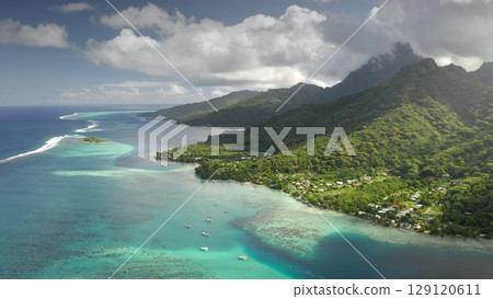 Aerial view of Moorea island tropical lagoon, French Polynesia. Turquoise water coral reef, green hill mountain, yachts anchor under blue clouds sky. Remote wild nature paradise, exotic summer travel Aerial view of Moorea island tropical lagoon, French Polynesia. Turquoise water coral reef, green hill mountain, yachts anchor under blue clouds sky. Remote wild nature paradise, exotic summer travel 129120611