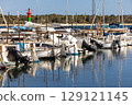 Small traditional llaut boats and sailbots are moored in the marina of Colonia de Sant Jordi, Majorca, Mallorca, Balearic Islands, Spain, Europe 129121145
