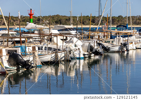 Small traditional llaut boats and sailbots are moored in the marina of Colonia de Sant Jordi, Majorca, Mallorca, Balearic Islands, Spain, Europe 129121145