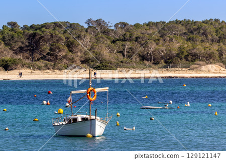Small traditional llaut boat and buoys in the harbor bay of Colonia de Sant Jordi, Majorca, Mallorca, Balearic Islands, Spain, Europe 129121147