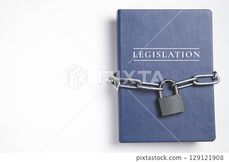 Legalization. Book with lock. A closed book is banned. Chain on the book. Legalization. Book with lock. A closed book is banned. Chain on the book. 129121908