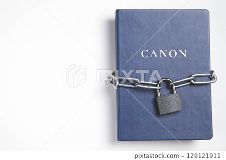 Canons. Book with lock. A closed book is banned. Chain wrapped the book. 129121911