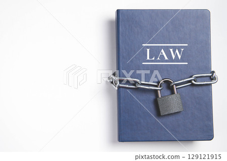 Law. Book with lock. A closed book is banned. The book was wrapped in a chain. 129121915
