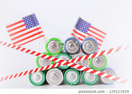 Battery. A lot of batteries on the background of the flag of the country. 129121929