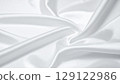 Smoothly wavy white silk texture background 129122986