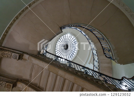 the Nelson Staircase within Somerset House in London, a grand spiral staircase inside a neoclassical building, 129123032