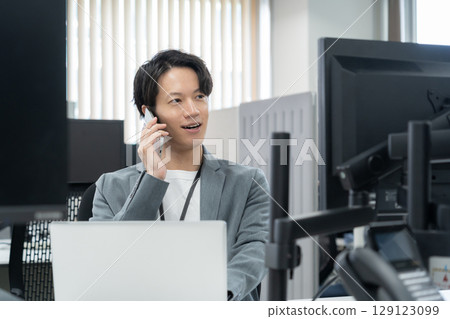A young male engineer in office casual wear A young male engineer in office casual wear 129123099