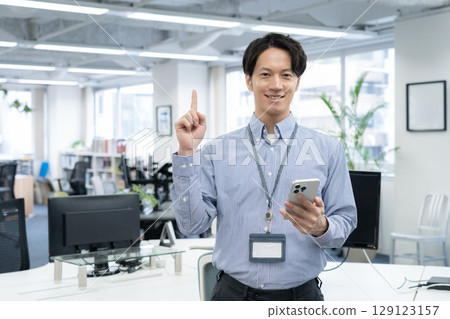 Young male engineer working in the office Young male engineer working in the office 129123157