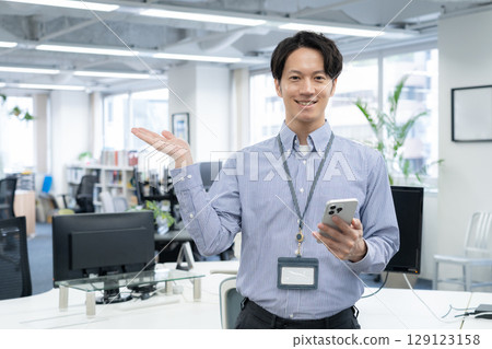 Young male engineer working in the office Young male engineer working in the office 129123158