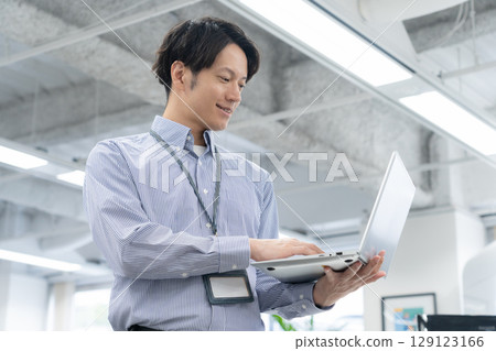 Young male engineer working in the office 129123166