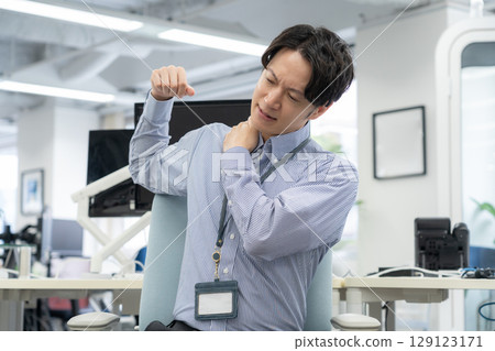 Young male engineer working in the office 129123171