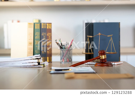 Legal Workspace. Professional law office with documents and gavel on the table. 129123288