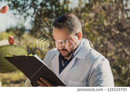 Man Doing Herborist Job And Writing Notes 129123795