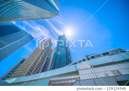 Tokyo cityscape, Japan, July 20th. Extremely hot... View of trains entering Shimbashi Station on the Yurikamome line. 129124346