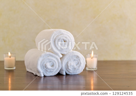 White towels and aroma candles White towels and aroma candles 129124535