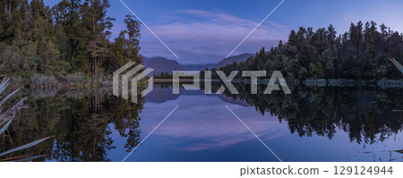 Mount Cook at sunset as seen from Lake Matheson on the West Coast of New Zealand 129124944