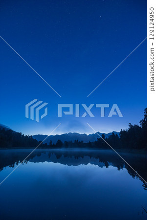 Mount Cook at sunset as seen from Lake Matheson on the West Coast of New Zealand Mount Cook at sunset as seen from Lake Matheson on the West Coast of New Zealand 129124950