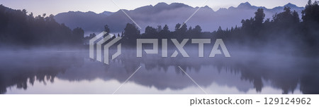 Mount Cook and the sunrise seen from Lake Matheson in the early morning mist, New Zealand Mount Cook and the sunrise seen from Lake Matheson in the early morning mist, New Zealand 129124962