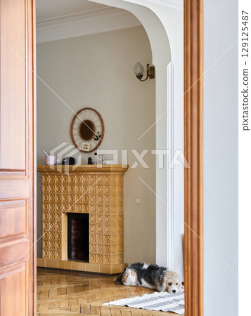 A Warm and Cozy Home Interior Featuring a Friendly Dog and Stylish Decorative Elements 129125487