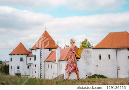 Woman Walking Through the Historic Center of Varazdin 129126233