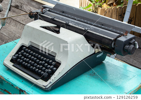 Vintage Typewriter Machine Closeup Photo. 129126259