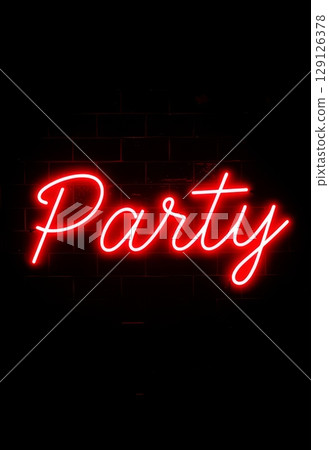 Red neon party sign glowing on black brick wall. Illuminated lettering for nightclub, event, and celebration design 129126378