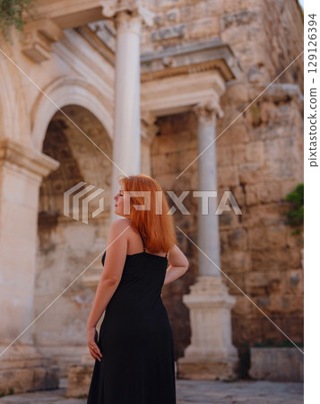 Young woman walking in old town, Antalya, Turkey Young woman walking in old town, Antalya, Turkey 129126394