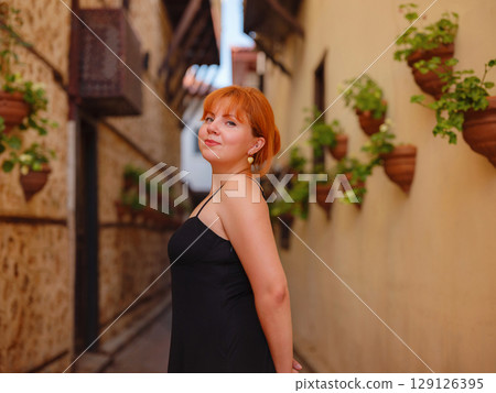 Young woman walking in old town, Antalya, Turkey Young woman walking in old town, Antalya, Turkey 129126395