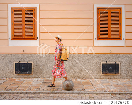 Woman Walking Through the Historic Center of Varazdin Woman Walking Through the Historic Center of Varazdin 129126778