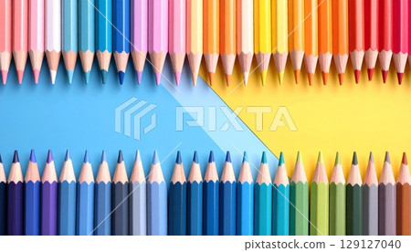 Colorful colored pencils on colored paper 129127040