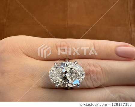 Luxury oval ring on brown suede Luxury oval ring on brown suede 129127393