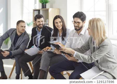 Business team of college friends discussing, brainstorming working online doing study project 129127896