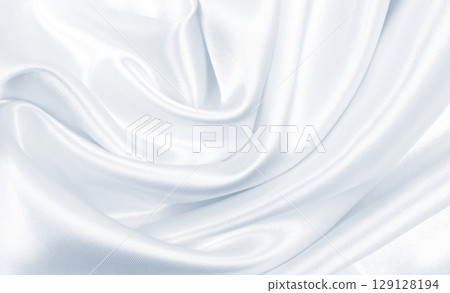 Smooth elegant grey silk or satin luxury cloth as wedding background. Luxurious background design 129128194