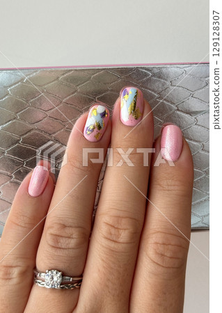 Elegant Hand with Modern Abstract Nail Art 129128307