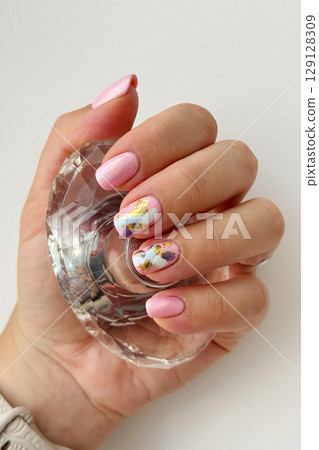 Elegant Hand with Modern Abstract Nail Art 129128309
