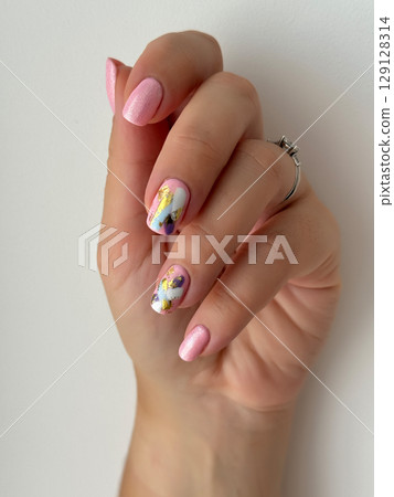 Elegant Hand with Modern Abstract Nail Art 129128314