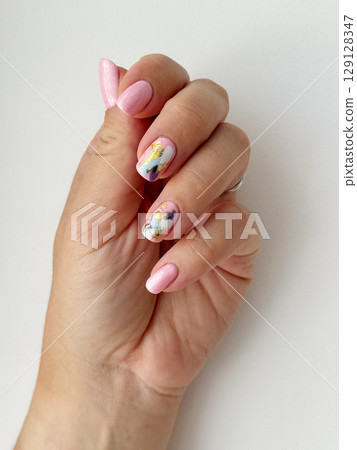 Elegant Hand with Modern Abstract Nail Art 129128347