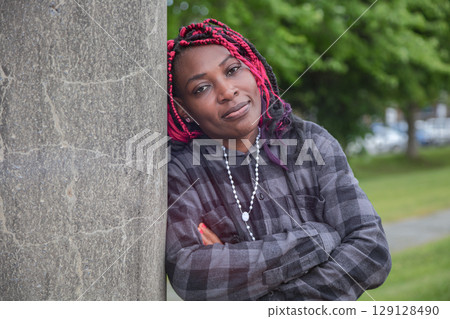 Mature African Woman Arms Crossed Concrete Mature African Woman Arms Crossed Concrete 129128490