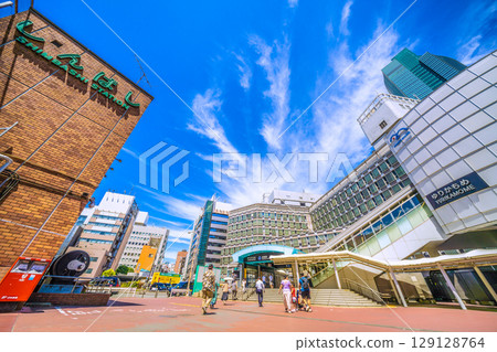 Tokyo cityscape, Japan, July 20th. Extremely hot... Yurikamome Line's Shimbashi Station and JR Shimbashi Station. 129128764