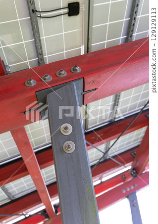 constructive detail of a wood and metal structure used to support solar panels 129129113