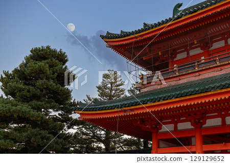 Rising moon floats above Heian Jingu vibrant rooftops in Kyoto Rising moon floats above Heian Jingu vibrant rooftops in Kyoto 129129652