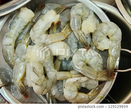 Fresh Raw Shrimp in Colander Ready for Preparation and Cooking for Delicious Seafood Dishes Fresh Raw Shrimp in Colander Ready for Preparation and Cooking for Delicious Seafood Dishes 129129934