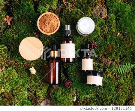 Assortment of Skincare Products on Vibrant Green Mossy Background in Flat Lay 129131145