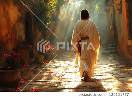 Jesus Christ walking into the light in a white robe and sandals 129131777
