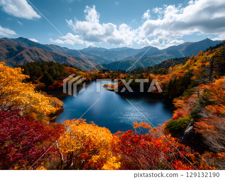 A spectacular view of the lake colored by autumn leaves and the Japanese Alps on a clear autumn day A spectacular view of the lake colored by autumn leaves and the Japanese Alps on a clear autumn day 129132190
