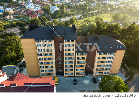 Aerial view of multistory apartment buildings in green residential area. 129132340
