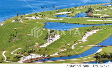 Aerial view of large golf field with green grass in Boca Grande, small town on Gasparilla Island in southwest Florida. Outdoor activities for wealthy people 129132373