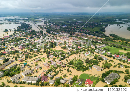 Aerial view of flooded houses with dirty water of Dnister river in Halych town, western Ukraine. 129132392